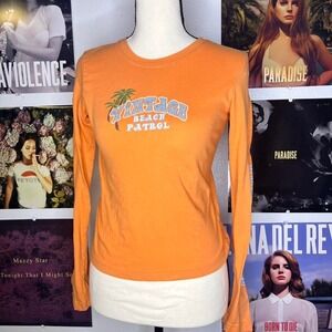 Mudd orange long sleeve top with "Vintage Beach Patrol" graphic